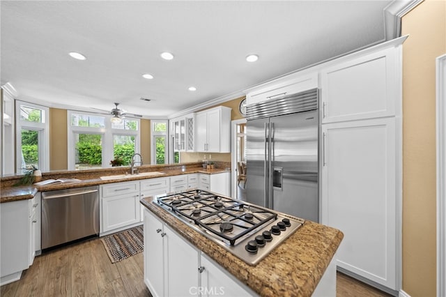kitchen featuring a wealth of natural light, recessed lighting, a sink, and appliances with stainless steel finishes