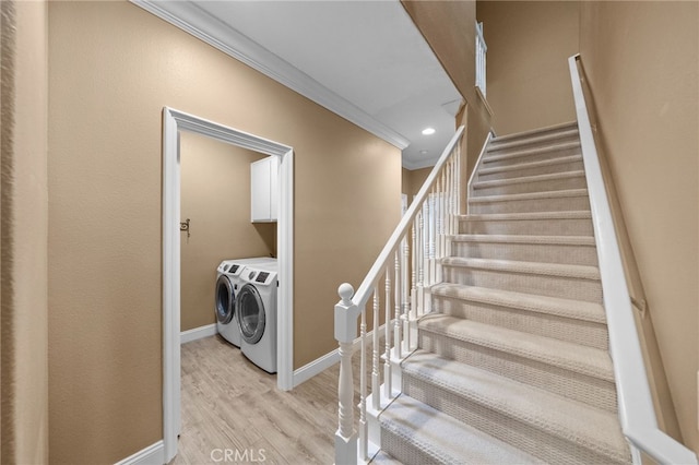 staircase featuring baseboards, recessed lighting, washing machine and dryer, crown molding, and wood finished floors