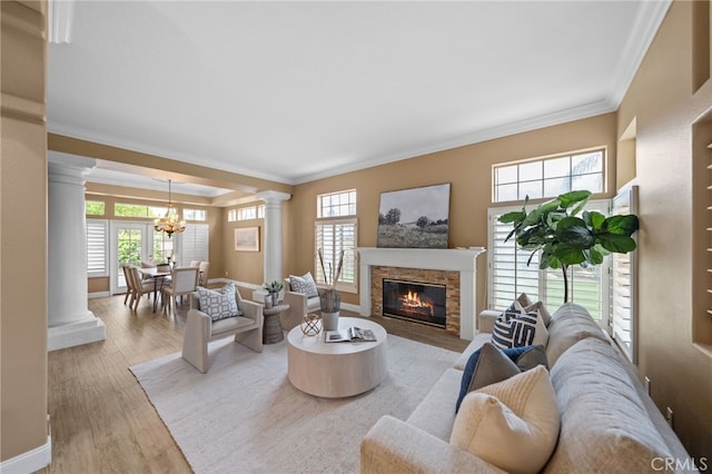 24240 Avenida De Marcia, Yorba Linda, CA 92887 - living room featuring decorative columns, ornamental molding, plenty of natural light, a chandelier, and wood finished floors