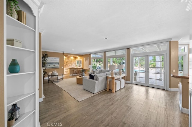 24240 Avenida De Marcia, Yorba Linda, CA 92887 - living area featuring french doors, crown molding, wood finished floors, plenty of natural light, and a textured ceiling