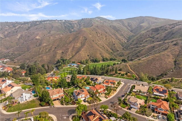 birds eye view of property with a mountain view and a residential view