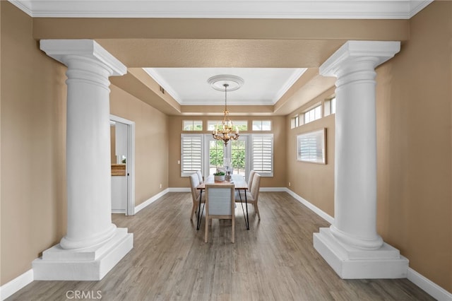24240 Avenida De Marcia, Yorba Linda, CA 92887 - dining area featuring ornate columns, a raised ceiling, wood finished floors, and ornamental molding