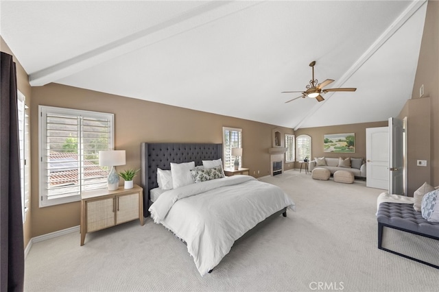 bedroom with light carpet, baseboards, and multiple windows