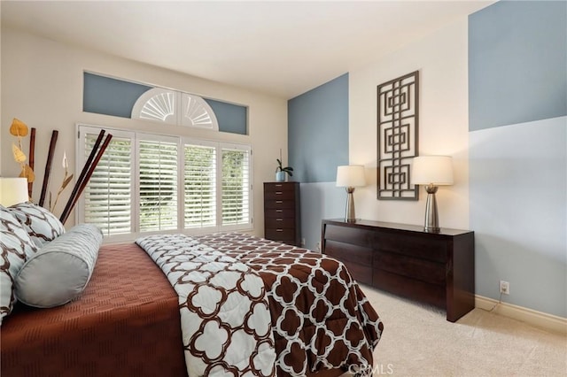 carpeted bedroom with baseboards