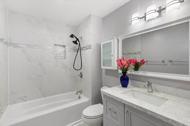full bathroom featuring toilet, vanity, and bathtub / shower combination