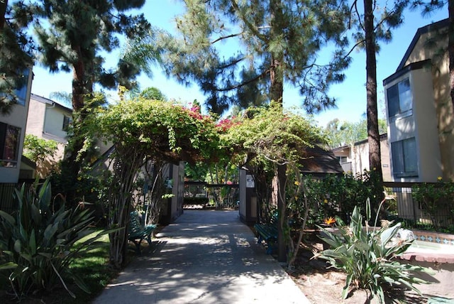 view of street featuring driveway and a gated entry