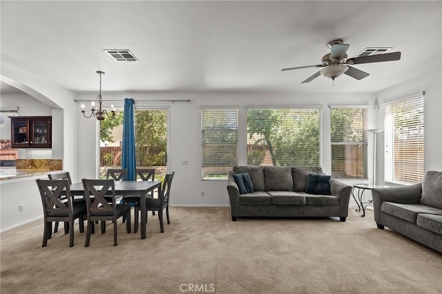 interior space featuring light colored carpet, visible vents, and plenty of natural light