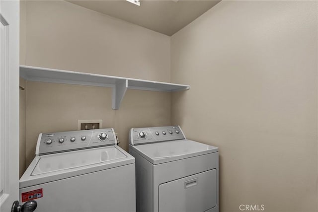 laundry room with washer and dryer and laundry area
