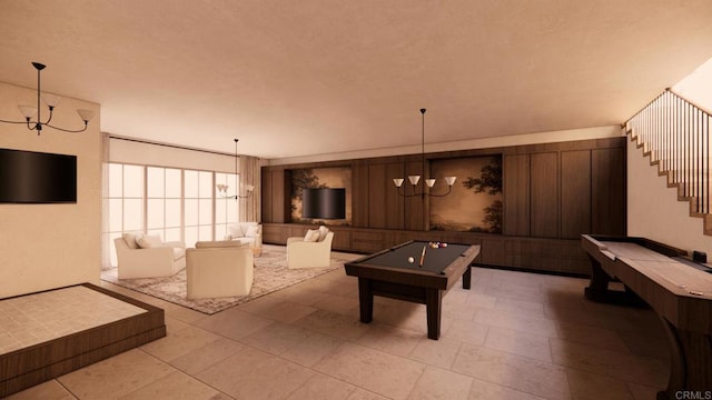 playroom with pool table and a notable chandelier