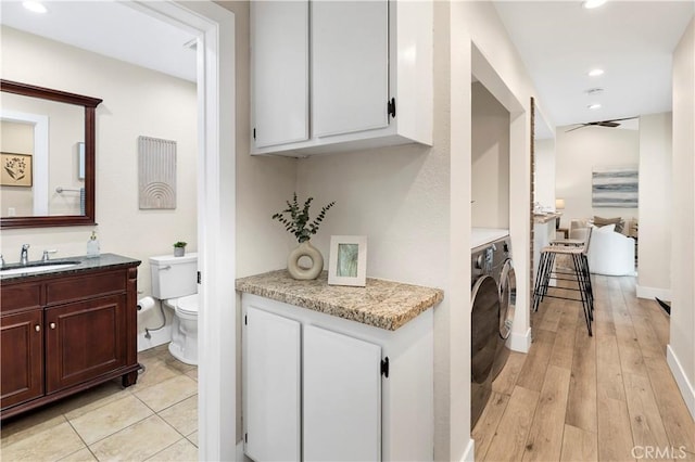 laundry room with recessed lighting, a ceiling fan, a sink, and laundry area