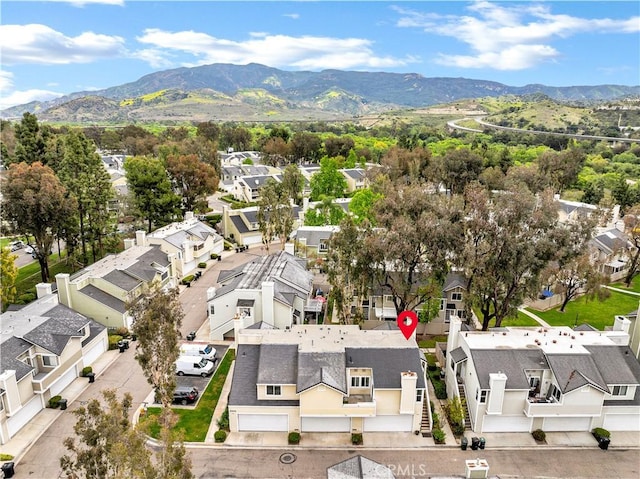 aerial view with a residential view and a mountain view