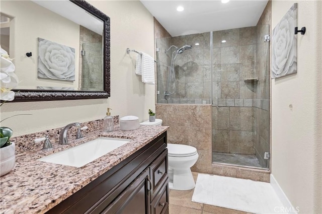 full bathroom with recessed lighting, a shower stall, toilet, and vanity