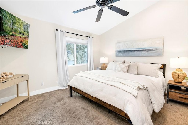 bedroom featuring baseboards, vaulted ceiling, carpet flooring, and ceiling fan