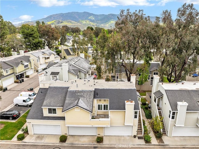 bird's eye view with a residential view and a mountain view