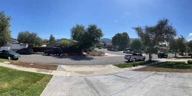 view of road with a residential view and sidewalks