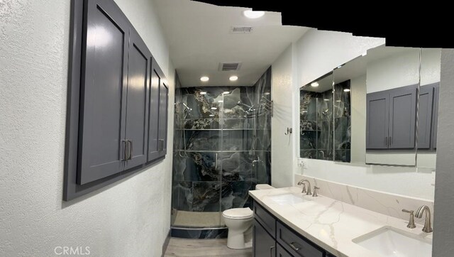 1387 Dyer Way, Corona, CA 92882 - full bath with a shower stall, double vanity, toilet, a textured wall, and recessed lighting