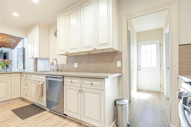10444 Flowerdale Ct, Sun Valley, CA 91352 - kitchen featuring light countertops, light wood finished floors, dishwasher, and stove
