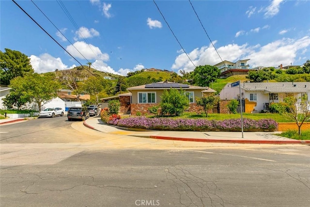 10444 Flowerdale Ct, Sun Valley, CA 91352 - ranch-style home with a residential view, uncovered parking, and roof mounted solar panels