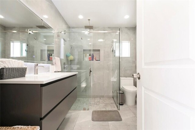 10444 Flowerdale Ct, Sun Valley, CA 91352 - full bathroom featuring toilet, vanity, a ceiling fan, and a stall shower