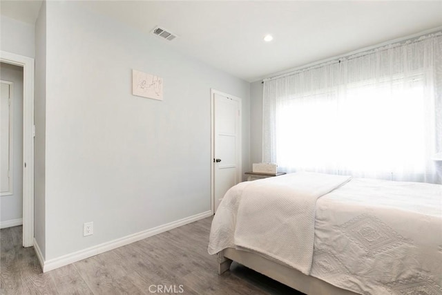 10444 Flowerdale Ct, Sun Valley, CA 91352 - bedroom with wood finished floors, baseboards, and visible vents