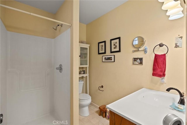 11 Maddie Ct, Chico, CA 95973 - bathroom with toilet, walk in shower, vanity, and baseboards