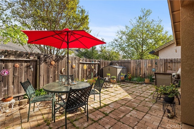 11 Maddie Ct, Chico, CA 95973 - view of patio / terrace featuring outdoor dining space, a fenced backyard, a shed, and an outdoor structure
