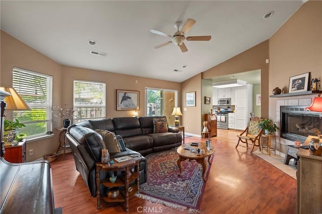 11 Maddie Ct, Chico, CA 95973 - living room with a fireplace, a ceiling fan, visible vents, lofted ceiling, and wood finished floors