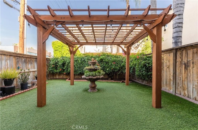 view of yard featuring a fenced backyard and a pergola