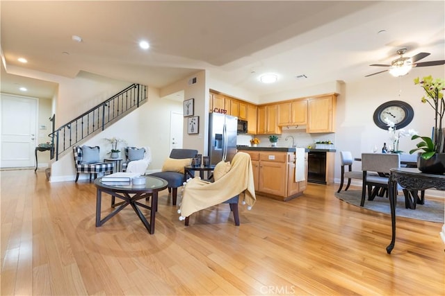 living area featuring recessed lighting, light wood-style flooring, stairs, visible vents, and ceiling fan