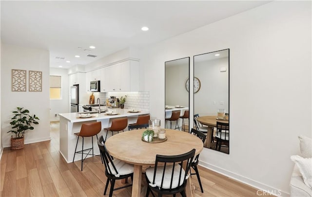 59 Sanctuary Ln, Mission Viejo, CA 92692 - dining space featuring visible vents, light wood-style flooring, and baseboards