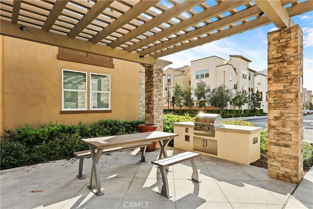 59 Sanctuary Ln, Mission Viejo, CA 92692 - view of patio / terrace featuring exterior kitchen, a residential view, area for grilling, and a pergola