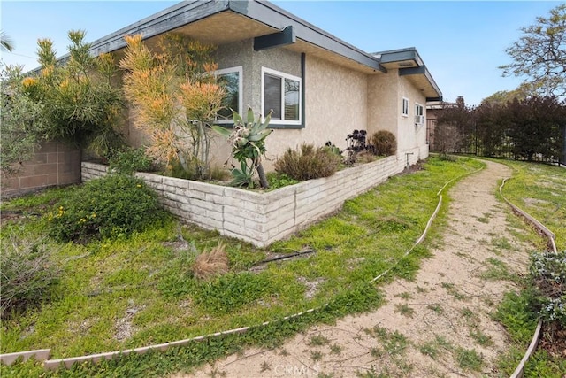 view of home's exterior with stucco siding