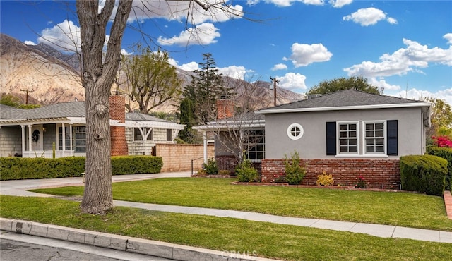 1492 Coolidge Ave, Pasadena, CA 91104 - ranch-style house featuring a mountain view, a chimney, stucco siding, brick siding, and a front lawn