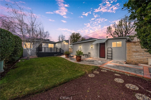 1492 Coolidge Ave, Pasadena, CA 91104 - mid-century modern home with a wooden deck, stucco siding, a lawn, a patio, and fence