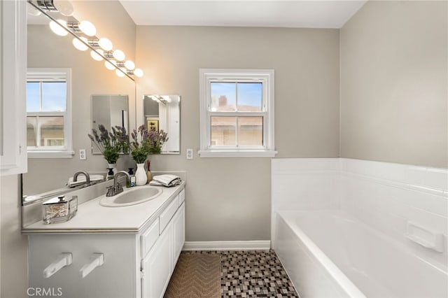 1492 Coolidge Ave, Pasadena, CA 91104 - bathroom featuring a bath, a healthy amount of sunlight, vanity, and baseboards
