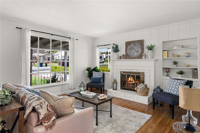 1492 Coolidge Ave, Pasadena, CA 91104 - living area featuring a brick fireplace, crown molding, and wood finished floors
