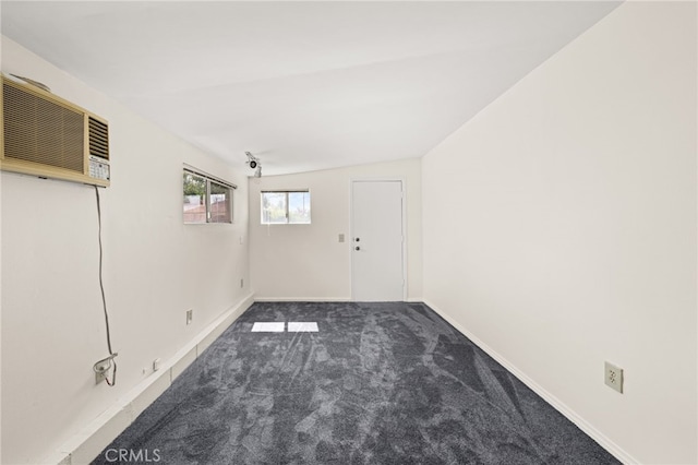 1492 Coolidge Ave, Pasadena, CA 91104 - spare room featuring a wall mounted air conditioner, baseboards, and carpet floors
