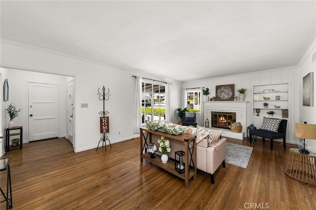 1492 Coolidge Ave, Pasadena, CA 91104 - living area with built in features, baseboards, a brick fireplace, ornamental molding, and wood finished floors