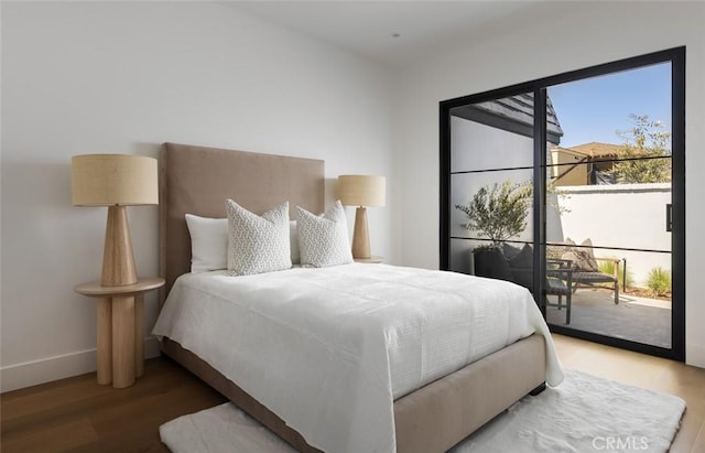3 Rue Valbonne, Newport Beach, CA 92660 - bedroom with access to exterior, baseboards, and wood finished floors