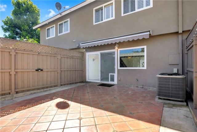 7200 Newton Way, Stanton, CA 90680 - back of house with central AC unit, fence, a patio, and stucco siding