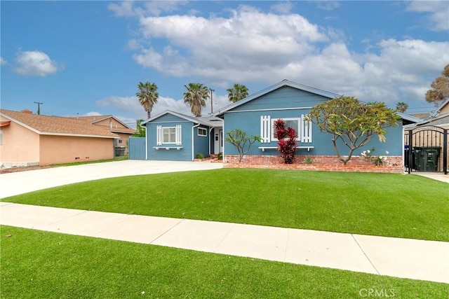 ranch-style home with concrete driveway and a front yard