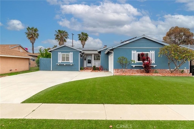 ranch-style house featuring concrete driveway, stucco siding, and a front yard