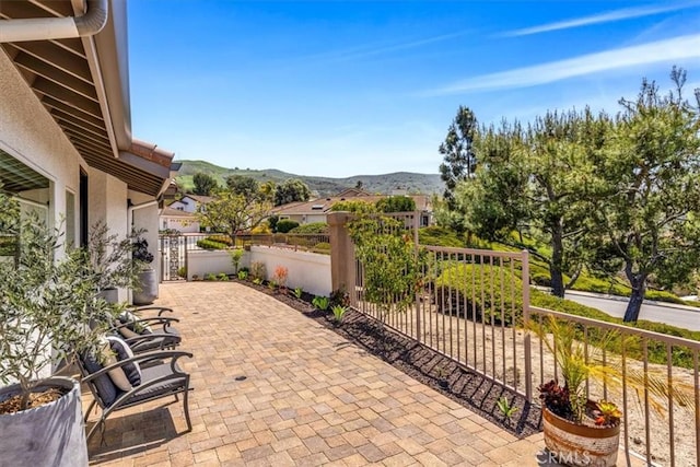 27553 Via Fortuna, San Juan Capistrano, CA 92675 - view of patio with a mountain view and fence