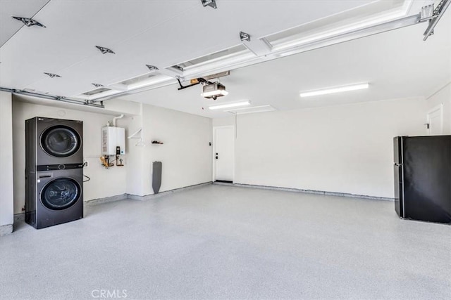 27553 Via Fortuna, San Juan Capistrano, CA 92675 - garage with water heater, freestanding refrigerator, stacked washer / dryer, and a garage door opener
