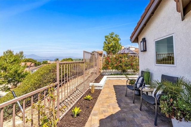 27553 Via Fortuna, San Juan Capistrano, CA 92675 - exterior space featuring fence, a patio area, and a mountain view