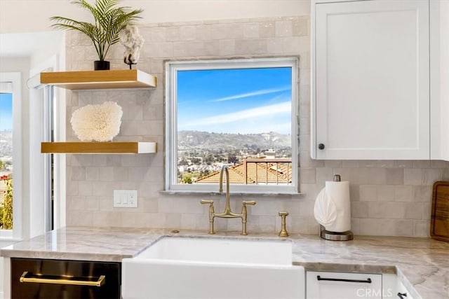 27553 Via Fortuna, San Juan Capistrano, CA 92675 - details with open shelves, tasteful backsplash, white cabinetry, and a sink