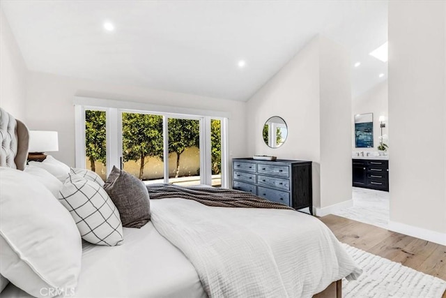 27553 Via Fortuna, San Juan Capistrano, CA 92675 - bedroom featuring light wood-type flooring, vaulted ceiling, baseboards, recessed lighting, and connected bathroom