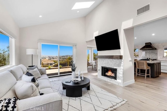 27553 Via Fortuna, San Juan Capistrano, CA 92675 - living room featuring visible vents, high vaulted ceiling, and a wealth of natural light