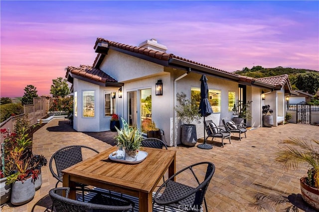 27553 Via Fortuna, San Juan Capistrano, CA 92675 - rear view of property with a tile roof, a patio area, a chimney, a fenced backyard, and stucco siding