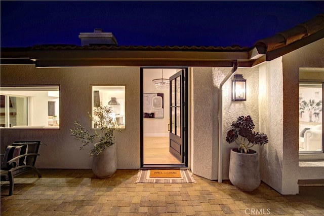 27553 Via Fortuna, San Juan Capistrano, CA 92675 - exterior entry at night with stucco siding